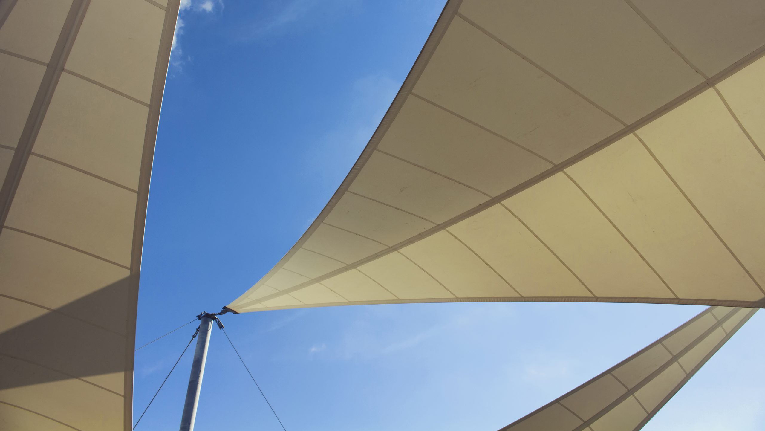 Bottom view of triangle shaped big sun shades and clear blue sky in the background in Bodrum which is Aegean coastal city of Turkey. DOGUSANQ F1600 TYPE V - Image 1
